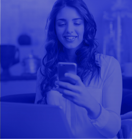 girl smiling at phone